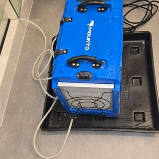 A blue Mounto dehumidifier used for water damage restoration by Harbaugh Restoration in Vancouver, WA.