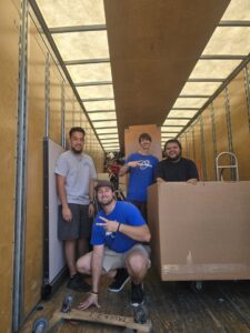Move Moore team members inside a moving truck with boxes and equipment in Grand Rapids, MI.