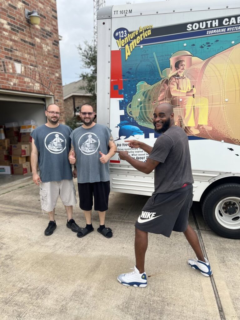 A mover from allpromovingservice interacting with customers next to a moving truck in San Antonio, TX.