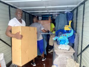 Advantage Express Movers team members efficiently packing a moving truck with boxes and furniture in Arlington, TX.