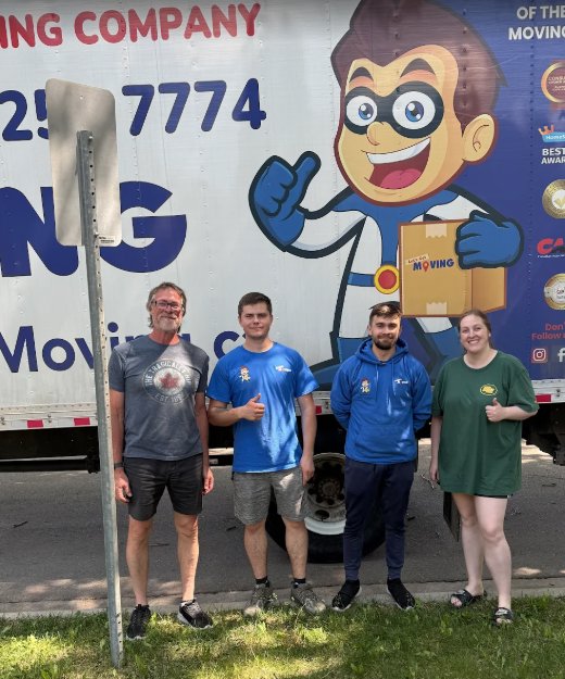 A happy moving crew giving thumbs up in front of a Let's Get Moving truck in Saint Petersburg, FL.