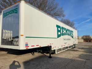 A large white Bekins moving trailer for N. L. Wilson Moving and Storage services in Olathe, KS.