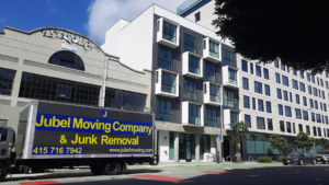 A Jubel Company LLC moving truck parked on a city street in front of a building in San Francisco, CA.