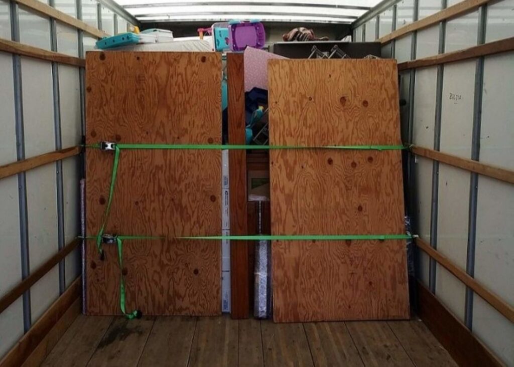 The interior of a moving truck with household items securely strapped in place by Packsen Moving in San Antonio, TX.