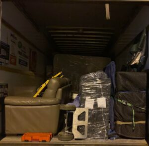Moving truck loaded with furniture, boxes, and equipment, showcasing services of Gifted Hands Moving & Storage in Collierville, TN.
