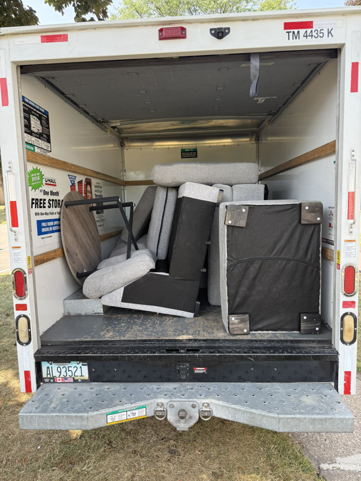 A moving truck loaded with furniture by The Purple Guys Roc in Rochester, NY