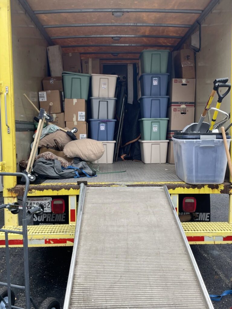 A moving truck loaded with household items and storage bins by ASAP Elite Hauling and Delivery in New Orleans, LA.