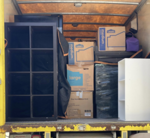 A moving truck loaded with various boxes and furniture by ASAP Elite Hauling and Delivery in New Orleans, LA.