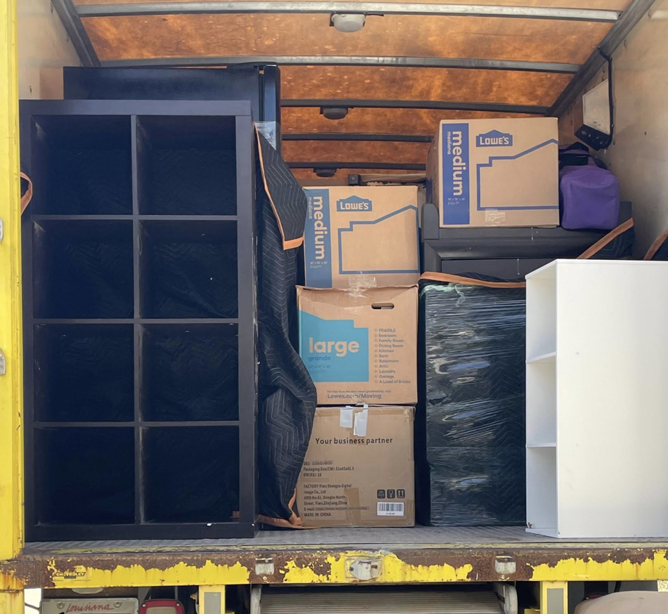 A moving truck loaded with various boxes and furniture by ASAP Elite Hauling and Delivery in New Orleans, LA.
