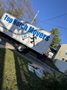 A Top Notch Movers truck parked on a residential street, ready for a moving job in Lauderhill, FL.