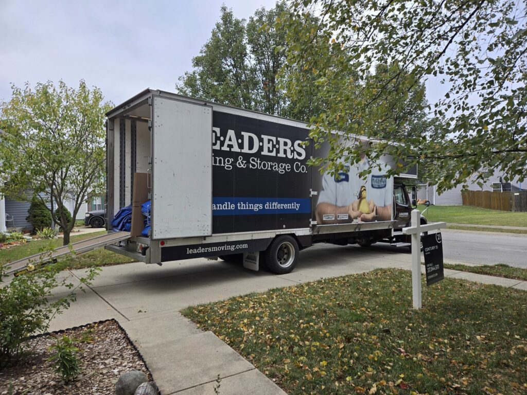 A Leaders Moving & Storage Co. truck with its ramp extended, ready for loading or unloading in Indianapolis, IN.