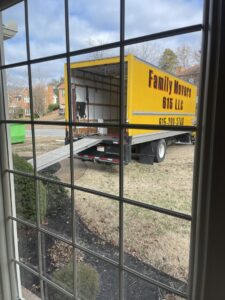 A Family Movers 615 LLC moving truck with its ramp extended, seen from inside a house during a job in Goodlettsville, TN.