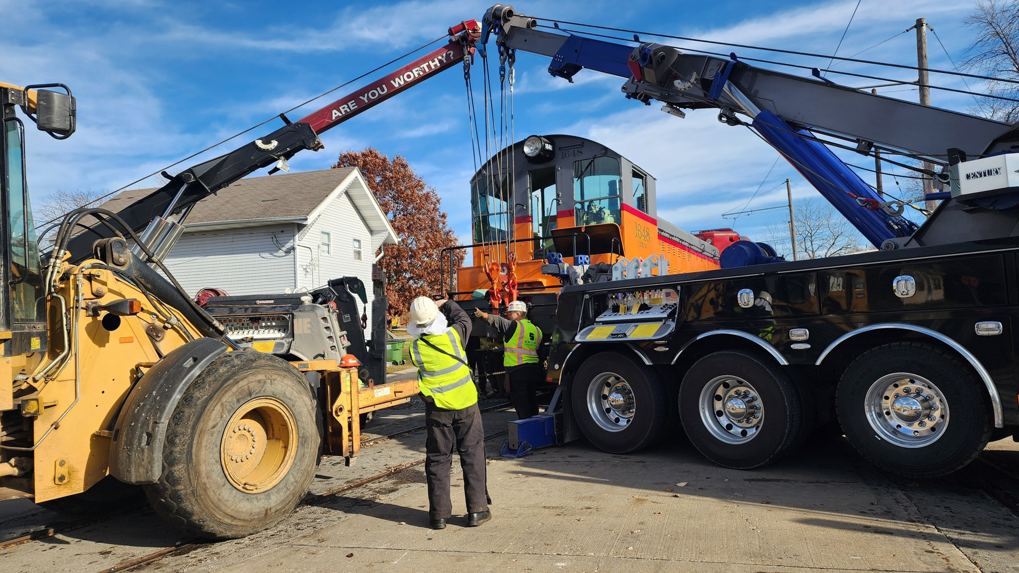 Elmquist Towing & Recovery performing a multi-vehicle heavy recovery operation for a train in Ames, IA.