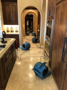 Multiple air movers drying a hallway and rooms after water damage by Best Dry Flood and Mold Specialists, Inc. San Diego, CA