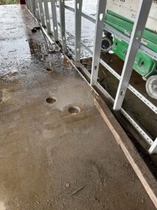 Multiple core-drilled holes in a concrete floor, showcasing precise cutting work by Valute Demolition in Jacksonville, FL.