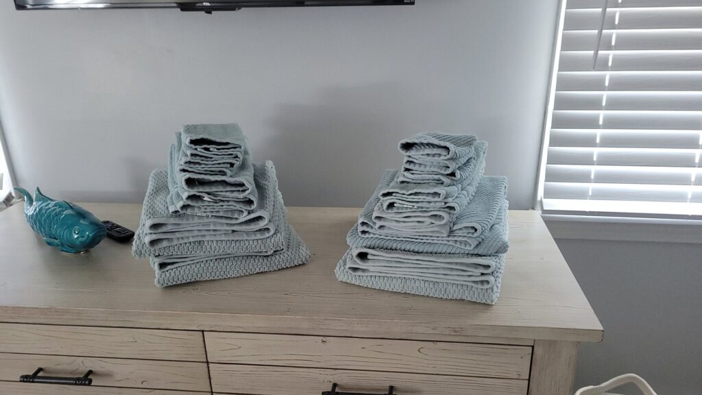 Freshly laundered and neatly folded towels, a detail of house cleaning by Solange D Kleaner in New Bedford, MA.