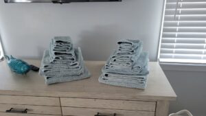 Freshly laundered and neatly folded towels, a detail of house cleaning by Solange D Kleaner in New Bedford, MA.