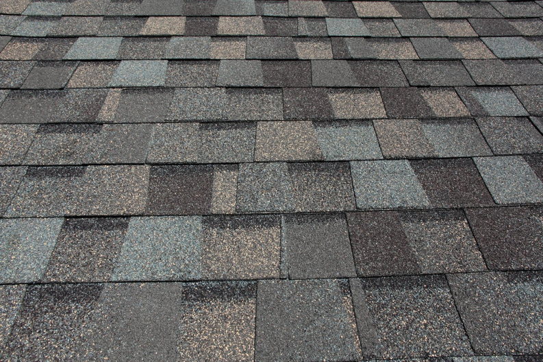 A newly installed asphalt shingle roof providing protection against water damage from Papillion Windows & Siding - NE in Papillion, NE.