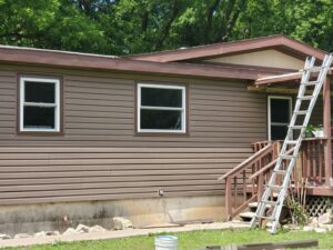 A residential home with new brown siding installed by River City Exteriors in San Antonio, TX