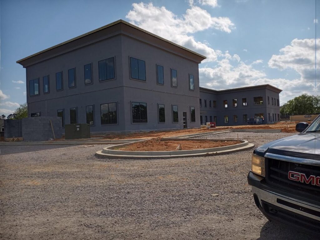 New commercial building construction showing brick and stucco siding by Eastern Stucco Restorations in Rock Hill, SC.