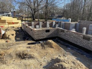 A new foundation under construction with waterproofing applied by Wetlock Waterproofing in Rock Hill, SC.