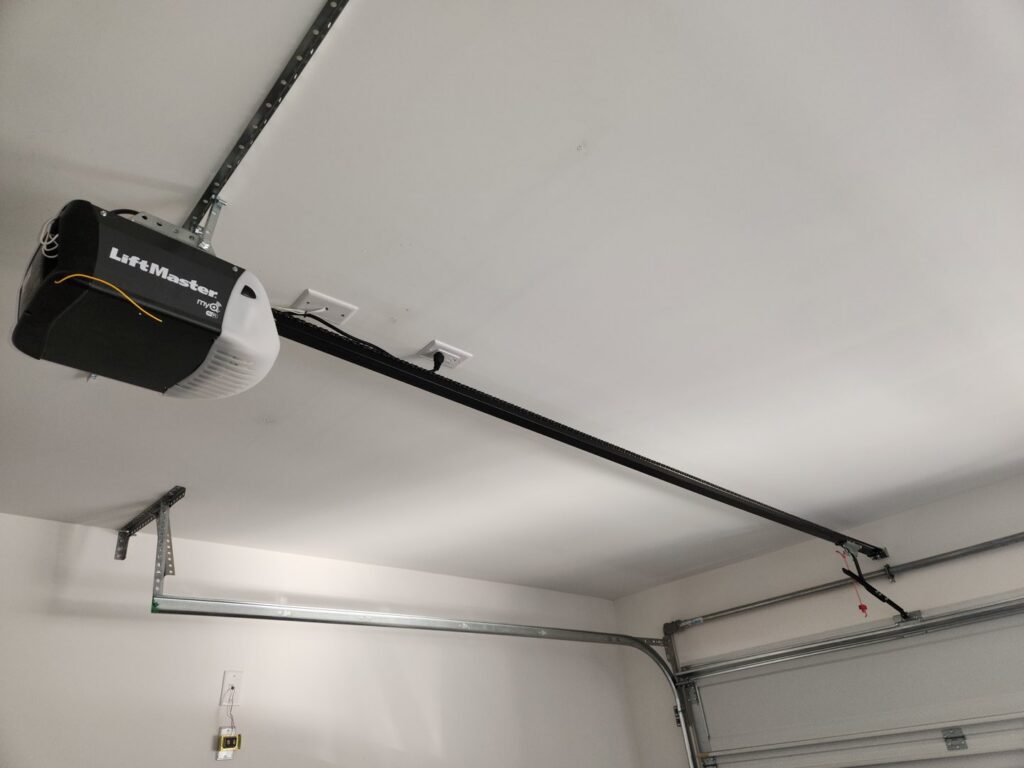 A newly installed LiftMaster garage door opener and track system by USA Doors in Doral, FL.