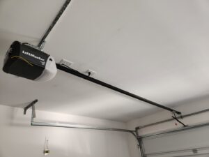 A newly installed LiftMaster garage door opener and track system by USA Doors in Doral, FL.