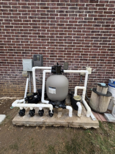 A newly installed pool filter and pump system by AW Pool Service in Tulsa, OK, ready for operation.