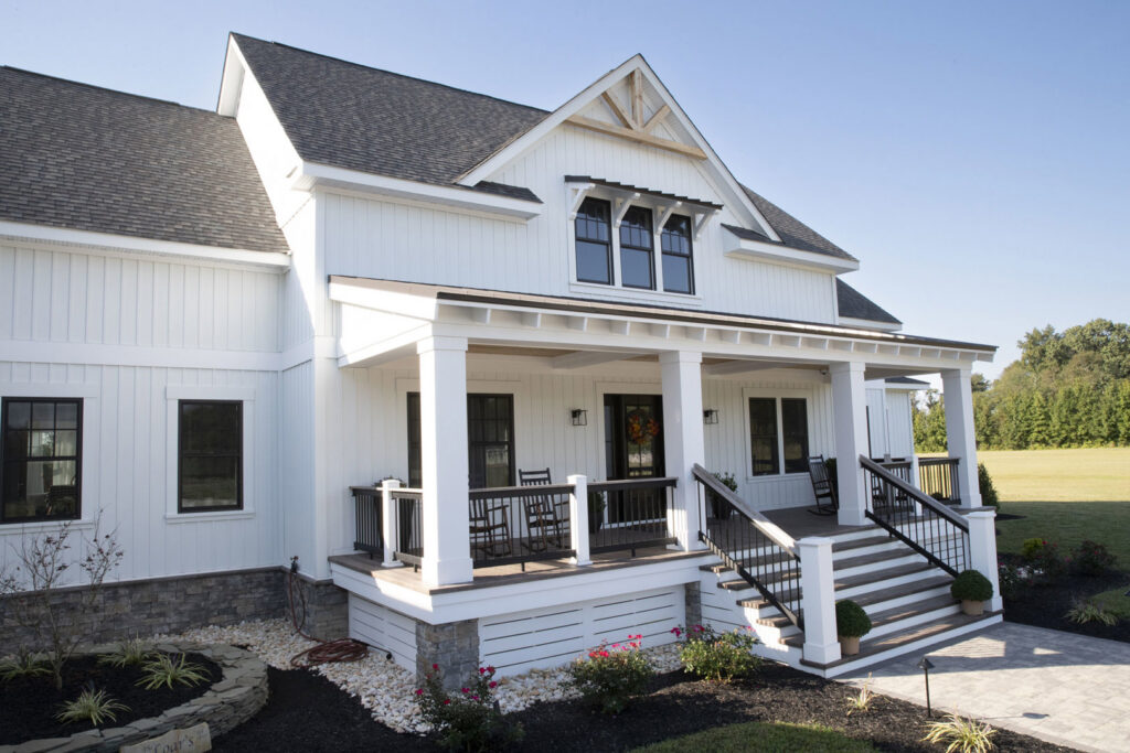 New white board and batten siding on a modern farmhouse style home by Ideal Siding Dallas, TX.