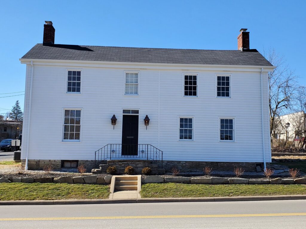 A beautiful two-story house with newly installed white siding by Stephenson Exteriors LLC in Cincinnati, OH.