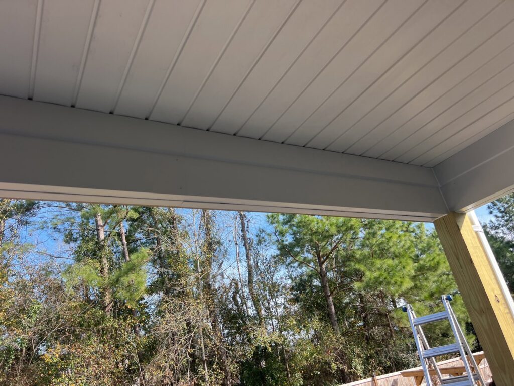 Newly installed white soffit panels under a house overhang, completed by Powell Roofing in Ladson, SC.