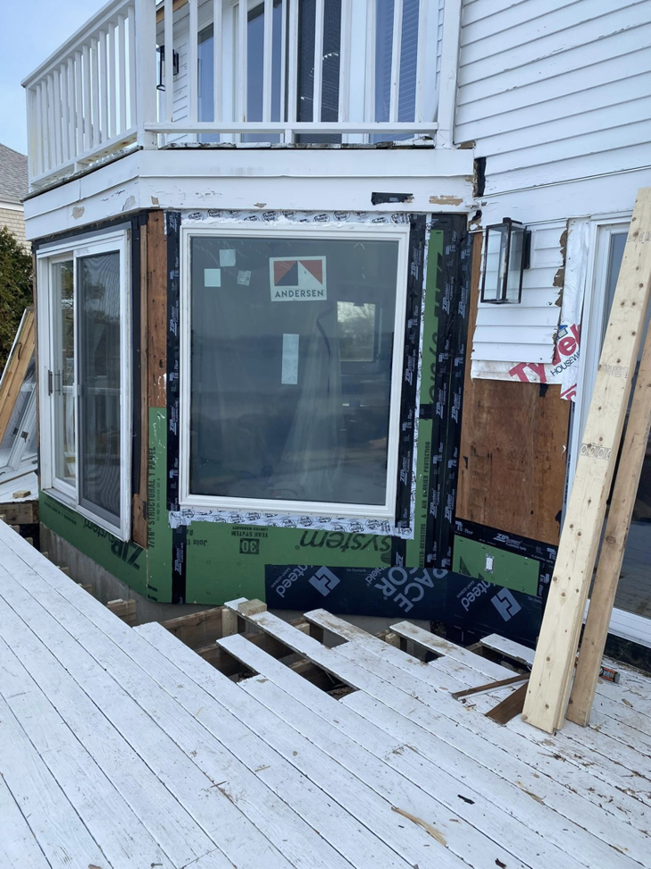 New window installation with weather barrier and flashing during water damage repair by Rival Property Maintenance in Biddeford, ME.