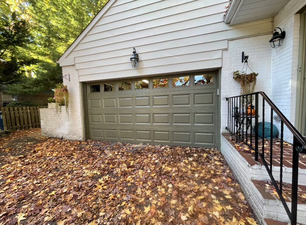 A newly installed brown garage door on a house by Delaware Express Garage Door Service in Wilmington, DE