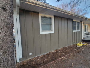 Newly installed vertical siding on the side of a house by D.A. Siding & Windows in Grand Island, NE.