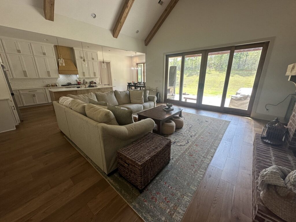 A bright, open-concept living room and kitchen area, impeccably cleaned by Top-Notch Tidy Services in Chesapeake, VA.