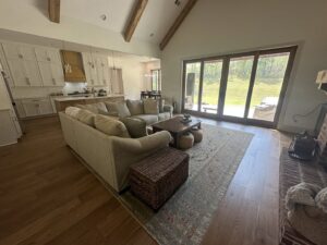 A bright, open-concept living room and kitchen area, impeccably cleaned by Top-Notch Tidy Services in Chesapeake, VA.