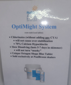 A sign detailing the OptiMight System for pool care at Pool Queen in Fairmont, WV.