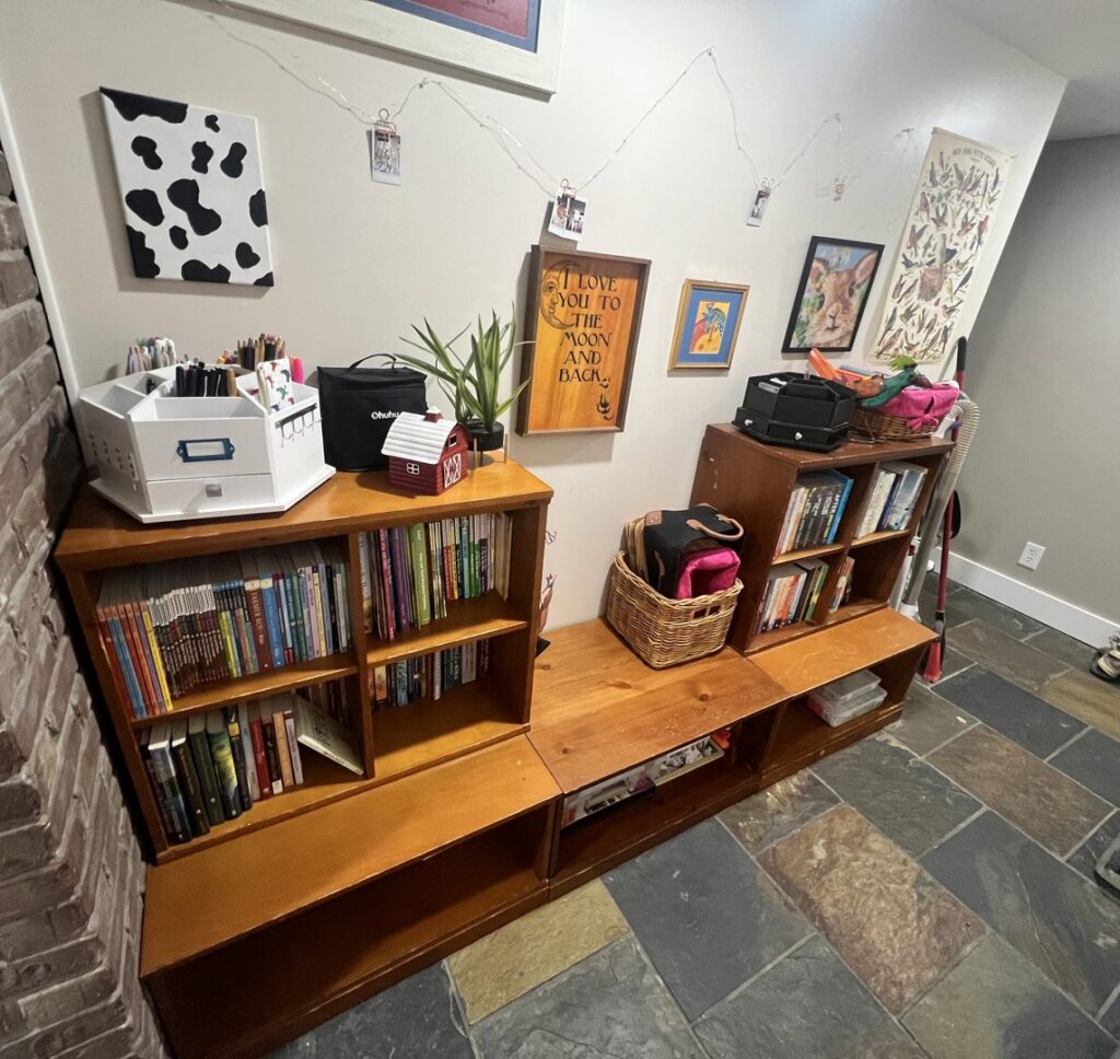 An organized corner with bookshelves and a clean tiled floor by Treadway's Cleaning Services in Spencer, IN