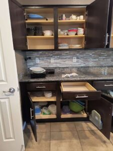 Neatly organized kitchen cabinets and drawers, showcasing a thorough cleaning service by Simplicity Services in Las Vegas, NV