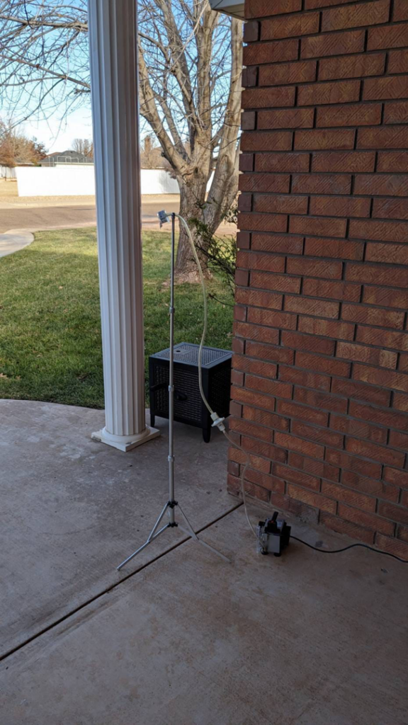 Outdoor air sampling equipment set up for mold testing by Peak Home Pro Restoration in Clovis, NM.