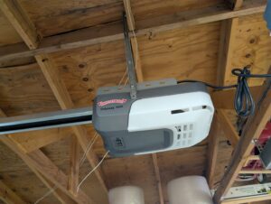 An Overhead Door Odyssey 1000 garage door opener professionally installed in a residential garage by Overhead Door Company of Santa Fe in Santa Fe, NM.