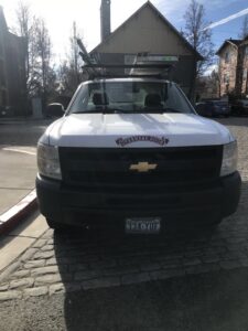 A white Overhead Door service truck ready for a job from Overhead Door of Sierra Nevada in Reno, NV.
