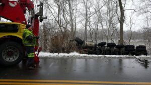 Bevis Towing performing an overturned tanker truck recovery from a snowy ditch in Cincinnati, OH.