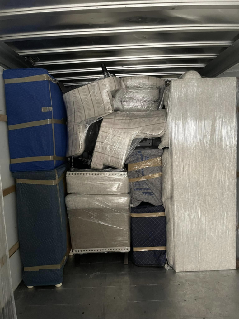 A moving truck interior packed with securely wrapped furniture by CNZ Moving in Raleigh, NC.
