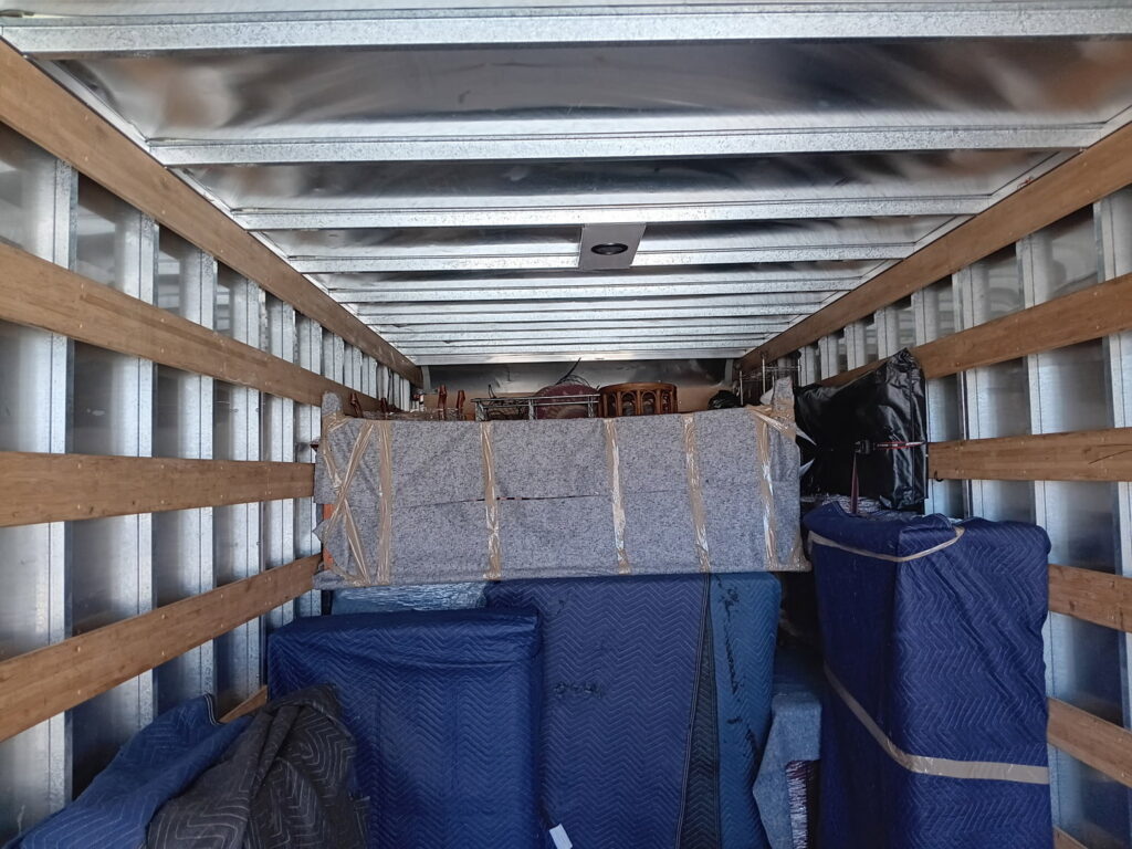 Interior of a moving truck expertly packed with furniture and boxes by Fatboy Slims Moving Company in Colorado Springs, CO.