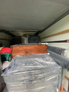 The interior of a moving truck fully packed with household goods by J&J Contracting and Consultation LLC in Parma, OH.