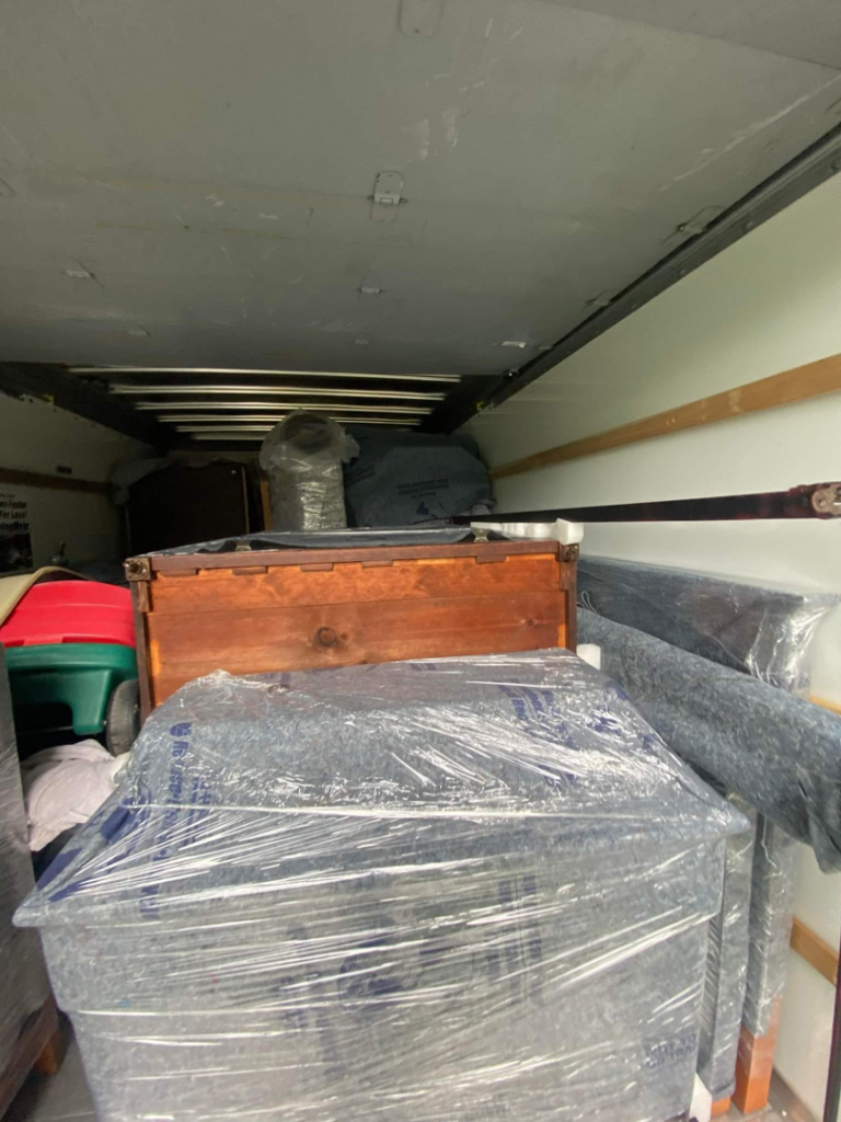 The interior of a moving truck fully packed with household goods by J&J Contracting and Consultation LLC in Parma, OH.