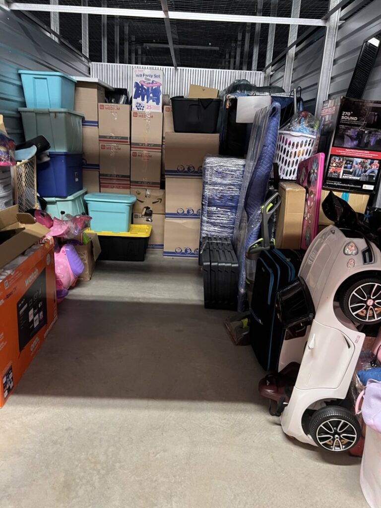 A neatly packed storage unit filled with boxes and household items by allpromovingservice in San Antonio, TX.