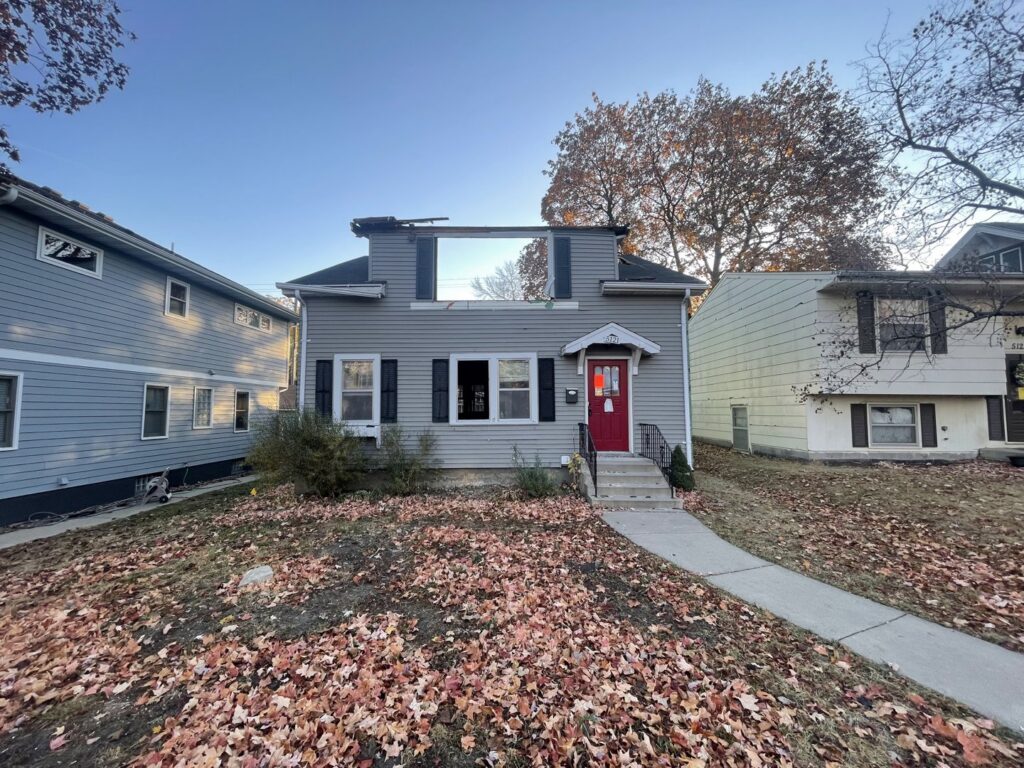 A house undergoing partial demolition with the roof and upper story removed by Rick's Demolition and Concrete Removal in Minneapolis, MN