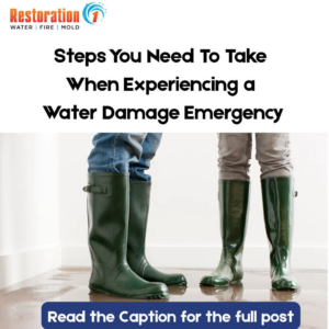 People wearing rubber boots standing in a puddle of water on a floor, indicating water damage, by Restoration 1 of NWA in Bentonville, AR.